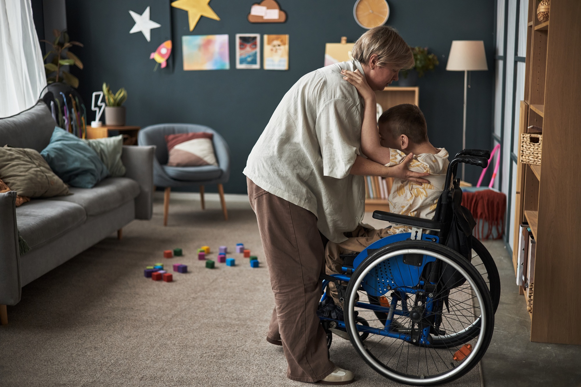 Caring for a Child in a Wheelchair in a Cosy Living Room.At Belcho Care, we believe that everyone deserves to live with dignity, independence, and comfort. We are a trusted provider of high-quality, person-centred care services in Bristol.